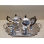 A Silver 4 piece tea service London 1948 Wakely and Wheeler on a Silver tray Birmingham 1947 Adie