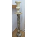 A marble column 98 cm tall , 23 cm wide , with a matching marble vase 34 cm tall