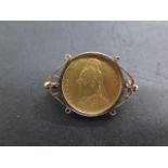 A Victorian gold full sovereign dated 1888 in a hallmarked 9ct brooch mount, approx 10.5 grams