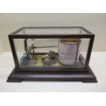 An oak cased barograph, 19cm tall x 36cm x 22cm, believed to be working but has not been tested