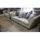 A pair of knolle type country house four seater sofas with scatter cushions each in two pieces for