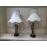 A pair of Ormulu figural table lamps on wooden bases with shades, 60cm tall with shades, both