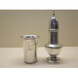 A silver caster, 17cm tall, and a silver tumbler, total weight approx 6.1 troy oz, generally good,