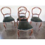 A set of four rosewood Victorian balloon back dining chairs with reupholstered seats, in good