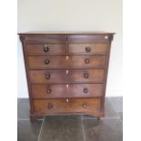 A Georgian oak and mahogany six drawer chest with an additional secret top drawer, some losses