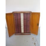 An early 1900s pine two drawer microscope slide cabinet with 48 drawers containing Neurology