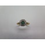 An 18ct yellow gold emerald and diamond ring, head size approx 9mm, ring size Q, approx 3.1 grams,