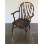 An early 20th century Windsor stickback elbow chair in good polished condition