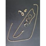 Two hallmarked 9ct gold chains, 35cm and 41cm long, three 9ct rings (2 missing stones), and a pair