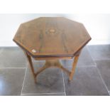 An Edwardian inlaid rosewood octagonal centre table with an undertier, 73cm tall x 82cm, in good