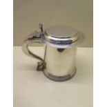 A silver lidded tankard, Birmingham 1908/09, S & B, 18cm tall, no engraving, approx 29 troy oz, in