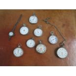 A collection of eight pocket watches including a silver pocket watch and a silver Trench type watch,