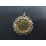 A Victorian gold half sovereign in a 9ct gold mount, total weight approx 7 grams