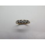 A five stone diamond ring comprising five transitional cut diamonds graduated in size, claw and