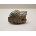 A Chinese 10th / 12th century jade carving of a tigers head pendant, 5cm x 3cm, some surface wear