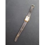 An 18ct yellow gold ladies Longines manual wind wristwatch, 18mm case, some marks to dial but