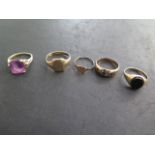 Four 9ct gold rings, one badly worn others some denting and wear, and a 14ct gold Amethyst ring,