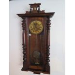 A walnut striking wallclock, 107cm tall