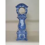 A blue and white china clock case, 45cm tall x 7.5cm diameter aperture