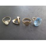 Four 9ct gold rings including a blue dress ring, size M, total weight approx 12 grams, all generally