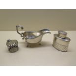 A silver caddy, London 1897/98 make J.H, 8.8cm, generally good, a silver mustard surround missing