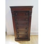 A 19th century oak Wellington chest with a rising top above six drawers on a plinth base, 122cm tall