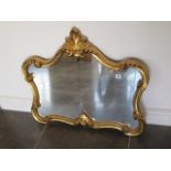 A modern ornate gilt mirror, 70cm tall x 79cm