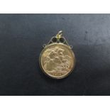 A George V gold full sovereign dated 1913 in a hallmarked 9ct mount total weight approx 9.1 grams
