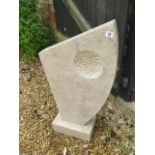 A hand carved limestone abstract garden sculpture made by a Cambridgeshire based stone carver,