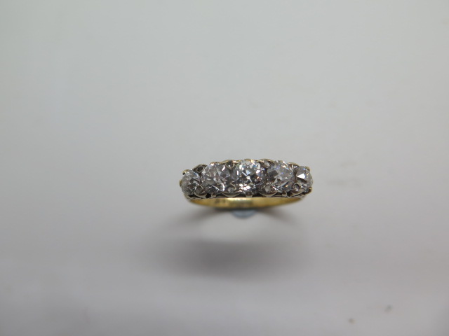 A five stone diamond ring comprising of five old European cut diamonds graduated in size between