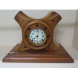 A propeller boss mantle clock with an Ansonia striking clock movement, 36cm tall x 49cm x 23cm,