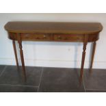 A new walnut two drawer D shaped hall table on turned legs, made by a local craftsman to a high