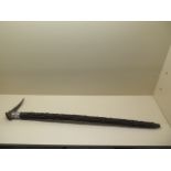 An unusual wooden walking cane with a horn handle and oriental white metal sleeve, 89cm long, in
