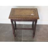 A carved oak stool on bobbin supports, 52cm tall x 46cm x 30cm