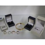 Eight silver and gilt dress rings and a gold plated bangle