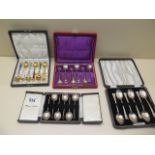 Three boxed sets of silver spoons and a boxed set of Ela Denmark sterling silver enamel spoons (3