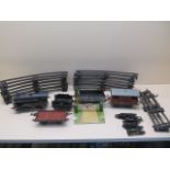 A Hornby 0 gauge clockwork tinplate train set with loco and tender and three wagons and track ,