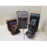An 1892 Instantograph patent bellow plate camera and a Kodak 3A Autographic Model C camera, both