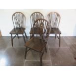 A set of four early 20th century wheelback dining chairs in good polished condition