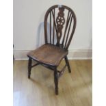 A 19th century seated Windsor child's chair (apparently the chair came from a family who had owned