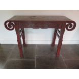 A Chinese 18th / 19th century lacquer altar table decorated with panels depicting scholars and