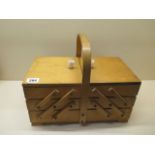 A 1960s extending sewing box with contents in good condition, 27cm tall x 33cm x 21cm