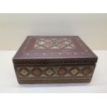 An embossed leather writing box with a fitted interior and pull out writing slope, 13cm tall x