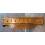 A vintage pine wall shelf with drawers, 87cm x 26cm x 16cm, in good polished condition