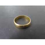 A 22ct yellow gold band ring, size N/O, approx 3.7 grams, some usage marks but generally good