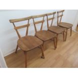 A set of four Ercol elm stacking children's chairs, 70cm tall, seat height 38cm, all are generally