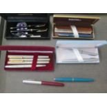 A collection of 11 ink pens, including two Parker cartridge pens