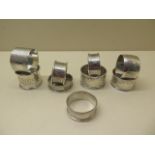 Nine assorted silver napkin rings, total weight approx 4.9 troy oz, all good condition