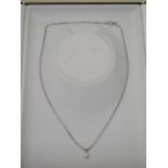 A diamond pendant on a white gold 18ct hallmarked Franco link chain, 41cm long, the round