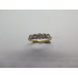 An 18ct five stone diamond ring, size K/L, hallmarked, diamonds bright, approx 2.1 grams, some